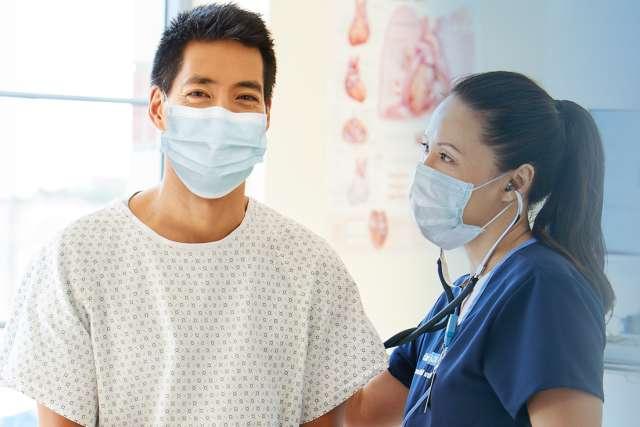 Asian patient with doctor wearing masks