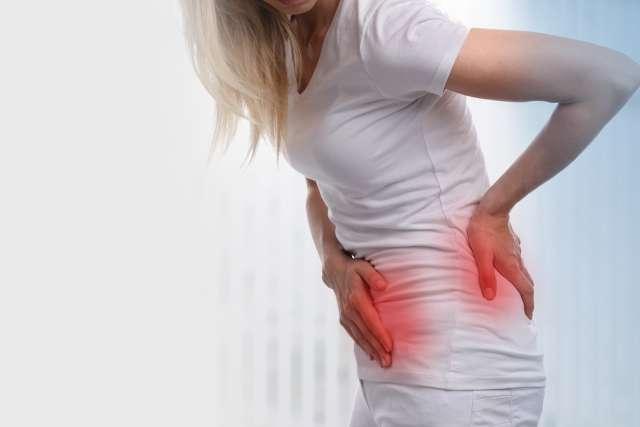 Woman experiencing kidney pain