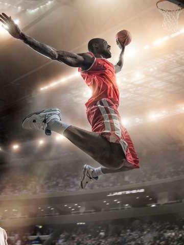 Basketball player jumping in mid air