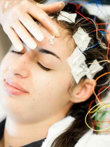 Young woman having an EEG test